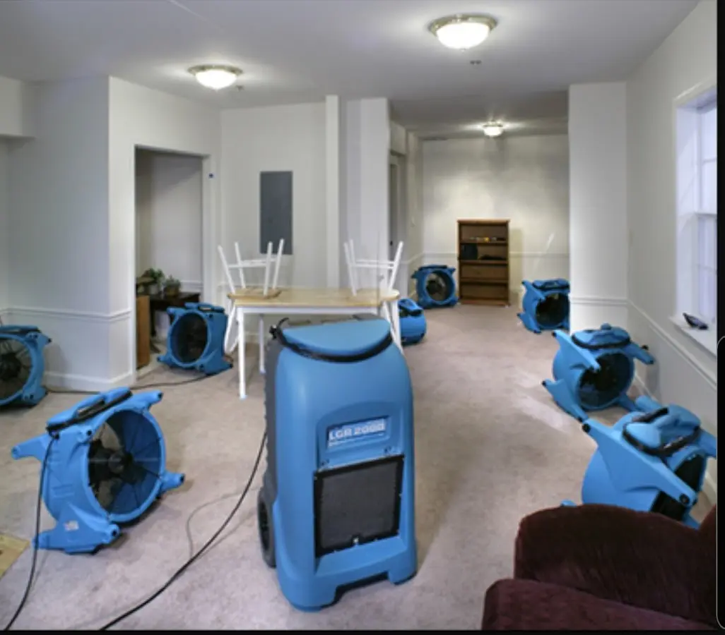 Air movers and dehumidifier setup for Water Damage Restoration in Spencer