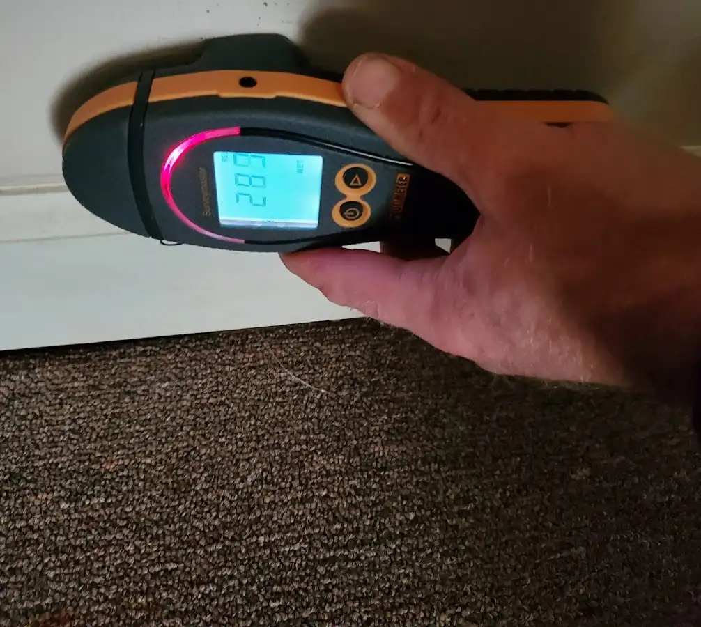 Moisture detection at baseboard during Mold Inspection & Testing in Spencer